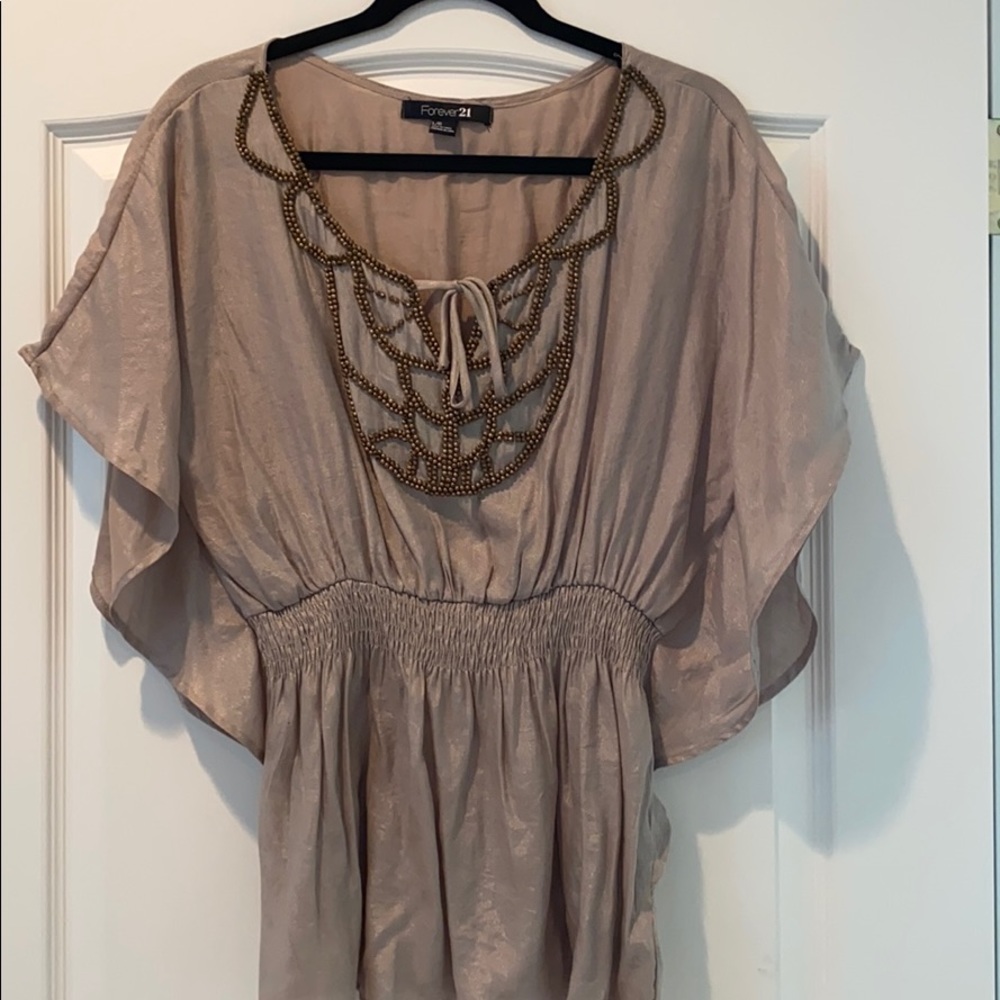 Gold blouse with detail